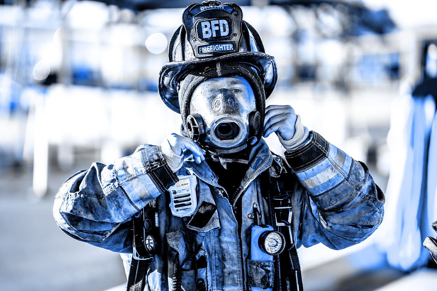 firefighter wearing his oxygen mask